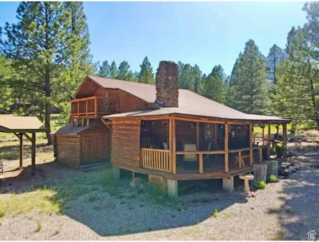 260 E Jensen Trl, Hatch, UT 84735 - rear view of house with a chimney and a deck