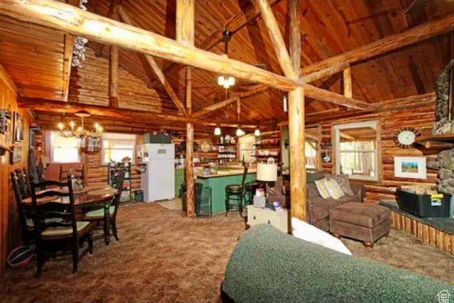 260 E Jensen Trl, Hatch, UT 84735 - carpeted living room featuring plenty of natural light, a chandelier, a wood ceiling with exposed beams, rustic walls, and high vaulted ceiling