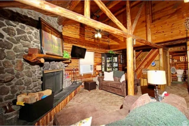260 E Jensen Trl, Hatch, UT 84735 - living area featuring a fireplace, wood walls, beam ceiling, ceiling fan, and high vaulted ceiling