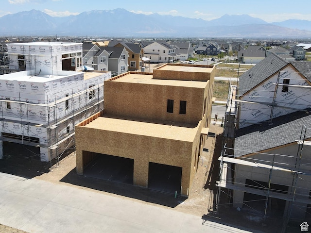 11378 S Aqua St W Unit 229, South Jordan, UT 84009 - view of building exterior featuring a mountain view, a residential view, a garage, and driveway