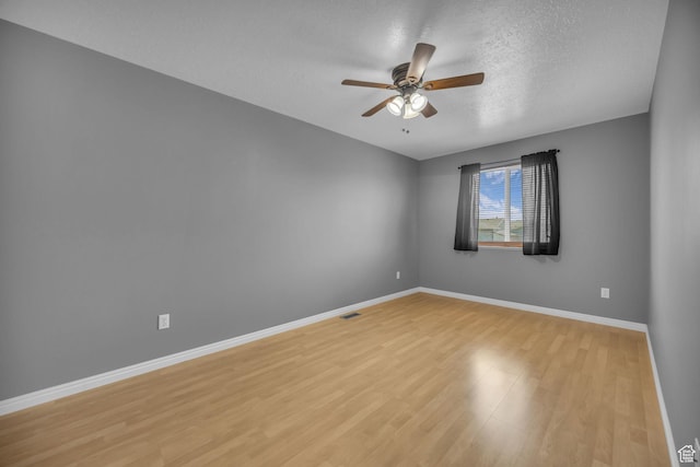 3820 Foxglen Dr, Roy, UT 84067 - spare room with ceiling fan, light wood-style flooring, and a textured ceiling