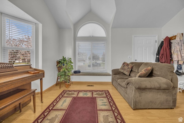 3820 Foxglen Dr, Roy, UT 84067 - living room with healthy amount of natural light, light wood finished floors, and vaulted ceiling