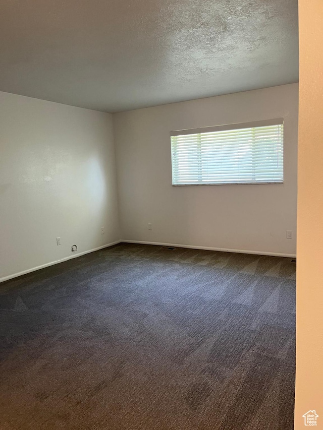 1455 N Amiron Way Unit A, Orem, UT 84057 - empty room featuring dark carpet and a textured ceiling