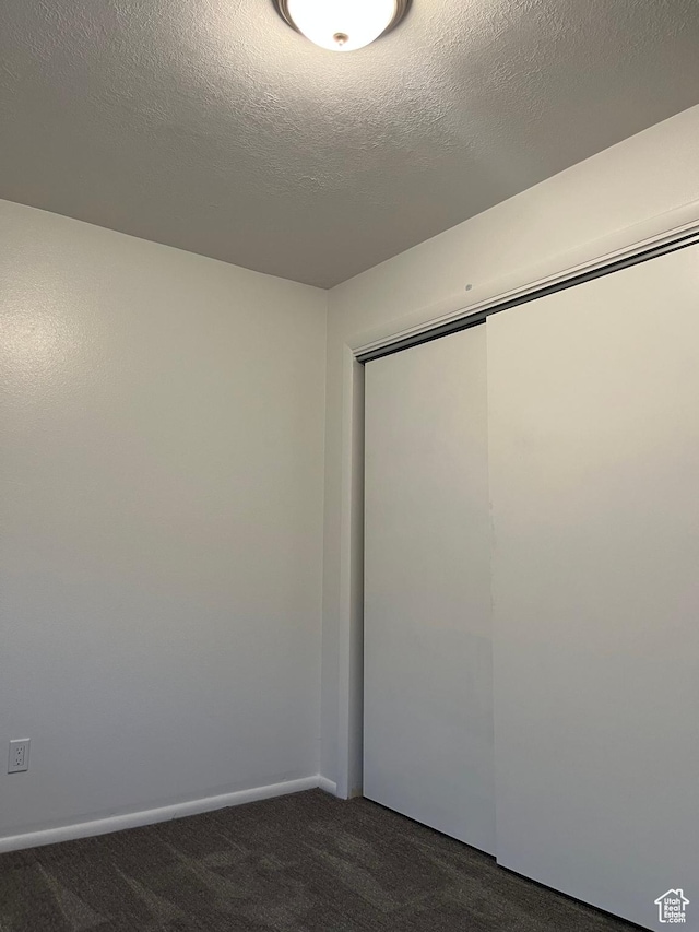 1455 N Amiron Way Unit A, Orem, UT 84057 - unfurnished bedroom featuring dark colored carpet and a closet