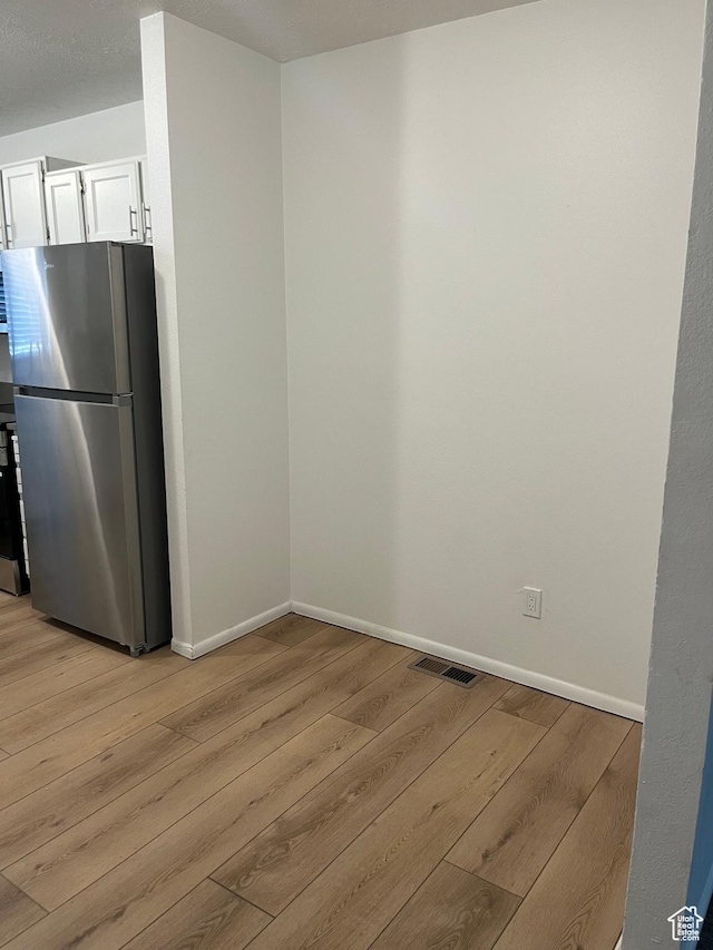 1455 N Amiron Way Unit A, Orem, UT 84057 - unfurnished dining area featuring light wood-style floors and baseboards