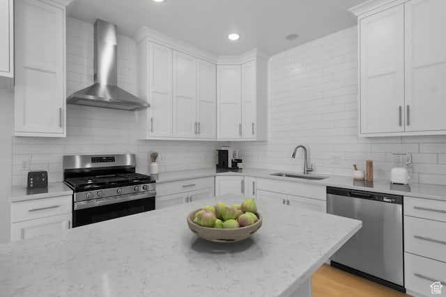 201 E 580 N, Providence, UT 84332 - kitchen featuring stainless steel appliances, wall chimney range hood, backsplash, white cabinets, and recessed lighting