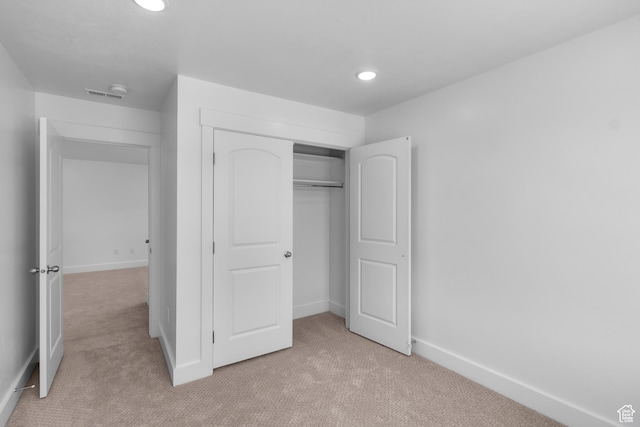 201 E 580 N, Providence, UT 84332 - unfurnished bedroom featuring light colored carpet, a closet, and recessed lighting