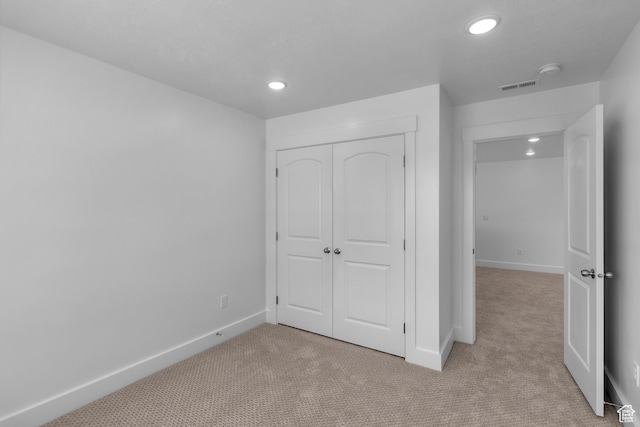 201 E 580 N, Providence, UT 84332 - unfurnished bedroom with light colored carpet, recessed lighting, and a closet