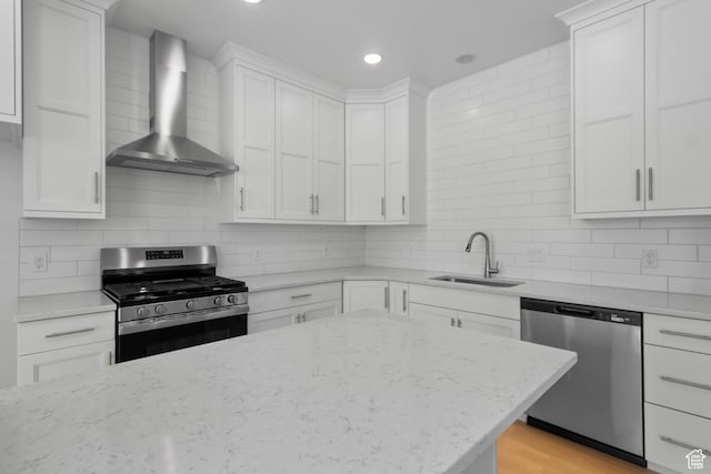 201 E 580 N, Providence, UT 84332 - kitchen featuring appliances with stainless steel finishes, wall chimney range hood, decorative backsplash, white cabinets, and recessed lighting