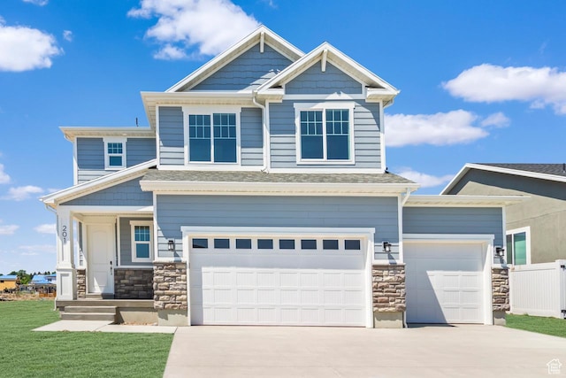 201 E 580 N, Providence, UT 84332 - craftsman-style home with stone siding, concrete driveway, covered porch, a garage, and roof with shingles
