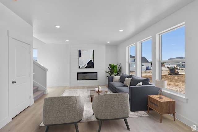 201 E 580 N, Providence, UT 84332 - living area with stairway, light wood-style flooring, recessed lighting, and a large fireplace