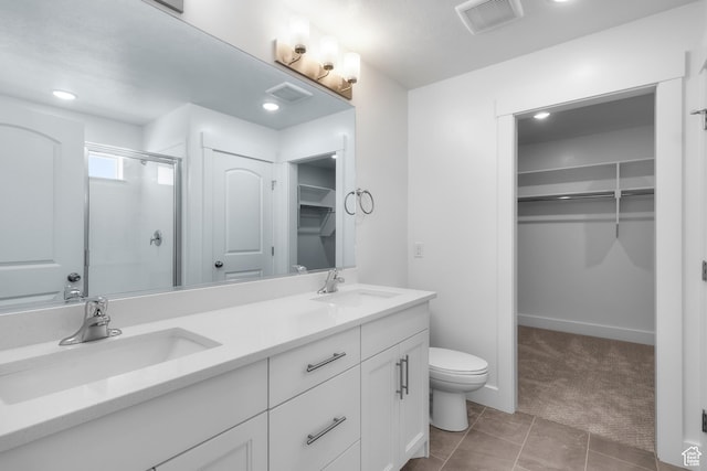 201 E 580 N, Providence, UT 84332 - bathroom featuring a spacious closet, a shower stall, double vanity, tile patterned floors, and recessed lighting