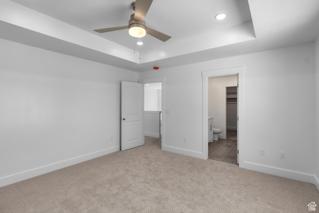 201 E 580 N, Providence, UT 84332 - unfurnished bedroom with light colored carpet, recessed lighting, a tray ceiling, a spacious closet, and a ceiling fan