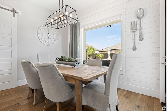 2918 E Willow Tree Ln, St George, UT 84790 - dining room with wood finished floors, a chandelier, and a barn door