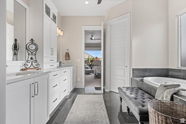 2918 E Willow Tree Ln, St George, UT 84790 - full bathroom featuring ceiling fan, double vanity, and a bath