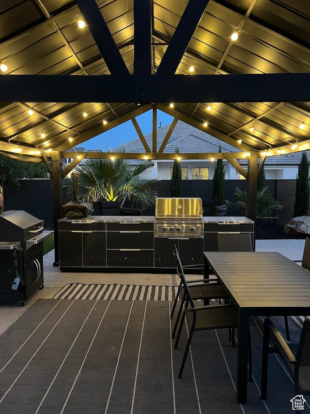 2918 E Willow Tree Ln, St George, UT 84790 - view of patio featuring exterior kitchen, outdoor dining area, and a gazebo