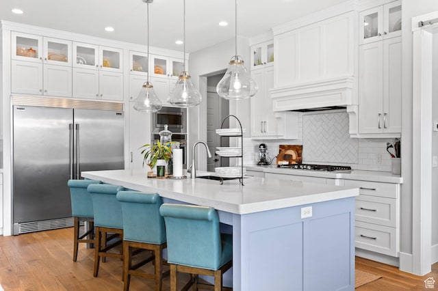 2918 E Willow Tree Ln, St George, UT 84790 - kitchen with built in appliances, light countertops, decorative backsplash, white cabinetry, and recessed lighting