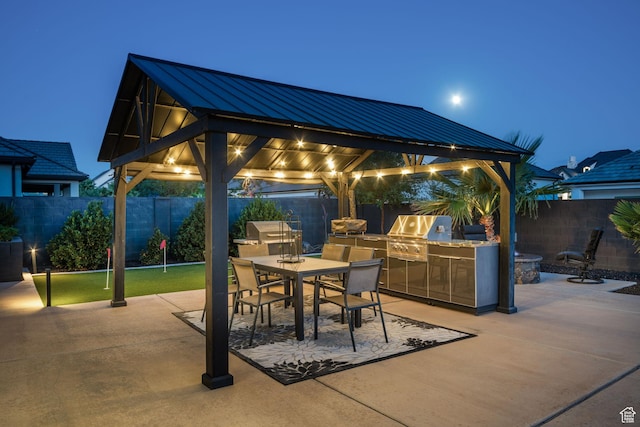 2918 E Willow Tree Ln, St George, UT 84790 - fenced backyard with exterior kitchen, a gazebo, a patio area, and outdoor dining area