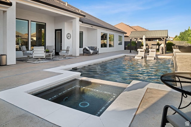 2918 E Willow Tree Ln, St George, UT 84790 - view of swimming pool with a patio and a pool with connected hot tub
