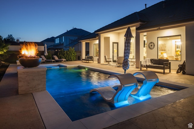 2918 E Willow Tree Ln, St George, UT 84790 - view of swimming pool with a patio and an outdoor living space with a fire pit