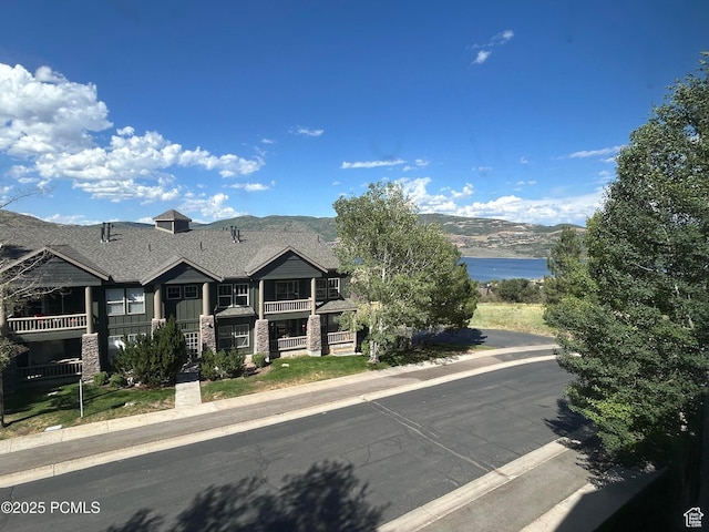 1729 Fox Bay Dr Unit J201, Heber City, UT 84032 - view of front of property featuring a balcony, roof with shingles, and a mountain view