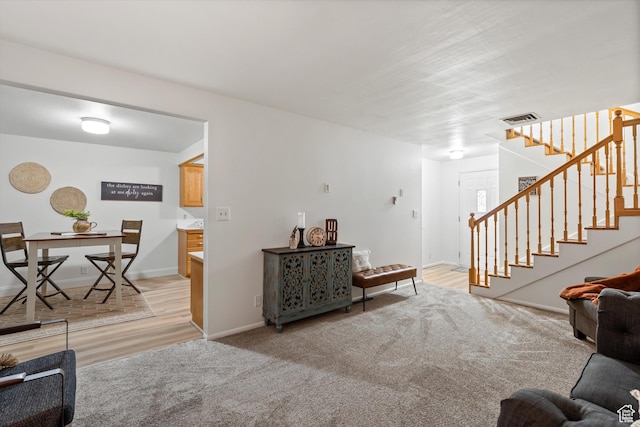 5430 S 850 E, South Ogden, UT 84405 - living room with stairs, light wood-style floors, and light carpet