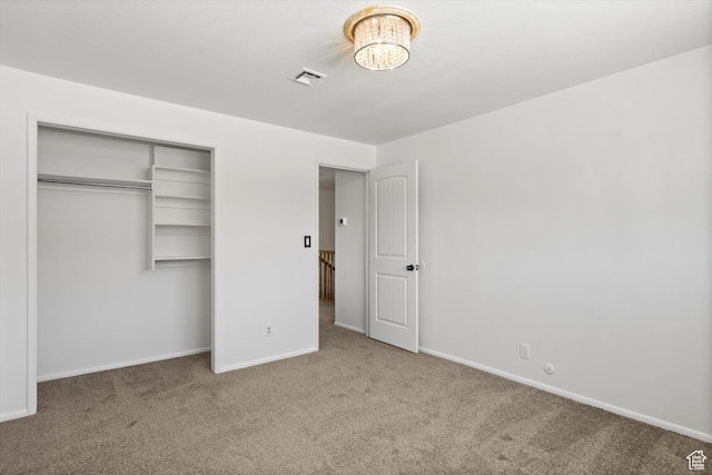 5430 S 850 E, South Ogden, UT 84405 - unfurnished bedroom with carpet flooring, a closet, and a chandelier