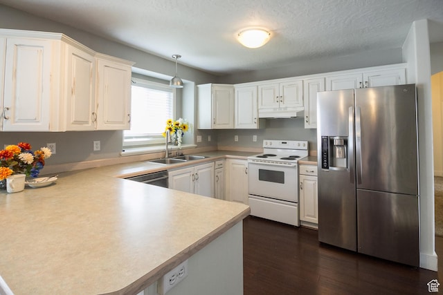 373 S 3240 W, Vernal, UT 84078 - kitchen with appliances with stainless steel finishes, under cabinet range hood, dark wood-type flooring, white cabinetry, and light countertops