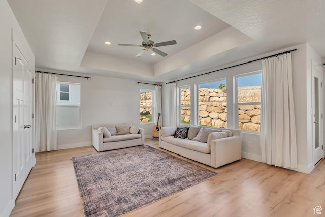 9728 N Aaron Ave Unit 115, Eagle Mountain, UT 84005 - living area featuring a raised ceiling, light wood-style flooring, ceiling fan, and recessed lighting