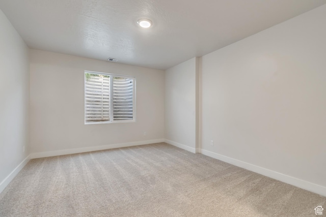 9728 N Aaron Ave Unit 115, Eagle Mountain, UT 84005 - spare room featuring light carpet and baseboards