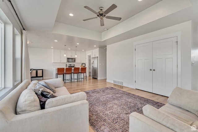 9728 N Aaron Ave Unit 115, Eagle Mountain, UT 84005 - living area featuring light wood-style flooring, a ceiling fan, and recessed lighting