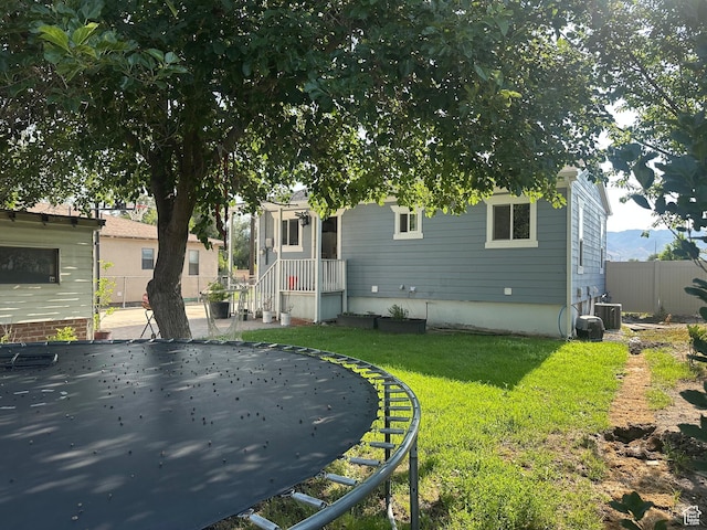 1540 S 900 W, Salt Lake City, UT 84104 - back of house featuring a trampoline