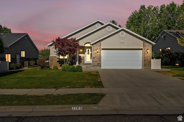 2265 N 515 E, North Ogden, UT 84414 - ranch-style home with driveway, a garage, a yard, and brick siding