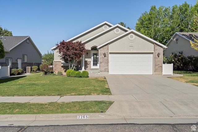 2265 N 515 E, North Ogden, UT 84414 - ranch-style home with a garage, driveway, a front lawn, and brick siding