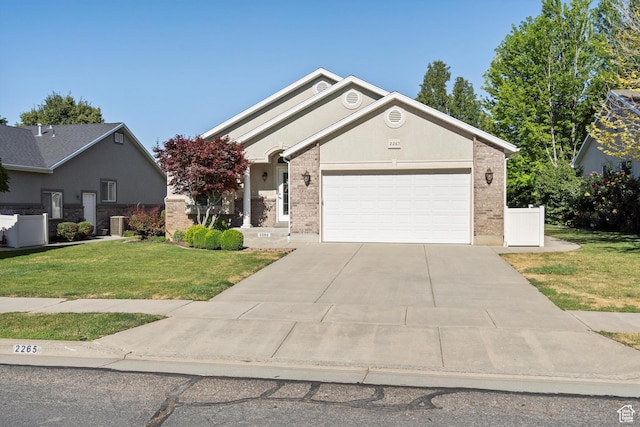 2265 N 515 E, North Ogden, UT 84414 - ranch-style home featuring a front lawn, driveway, a garage, and brick siding