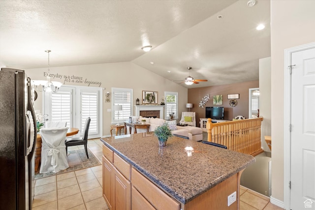 2265 N 515 E, North Ogden, UT 84414 - kitchen featuring freestanding refrigerator, a ceiling fan, vaulted ceiling, healthy amount of natural light, and light tile patterned floors