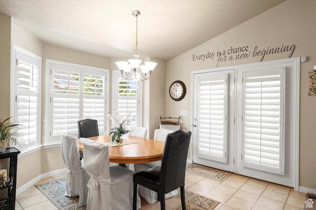 2265 N 515 E, North Ogden, UT 84414 - dining area with a chandelier, light tile patterned flooring, and lofted ceiling