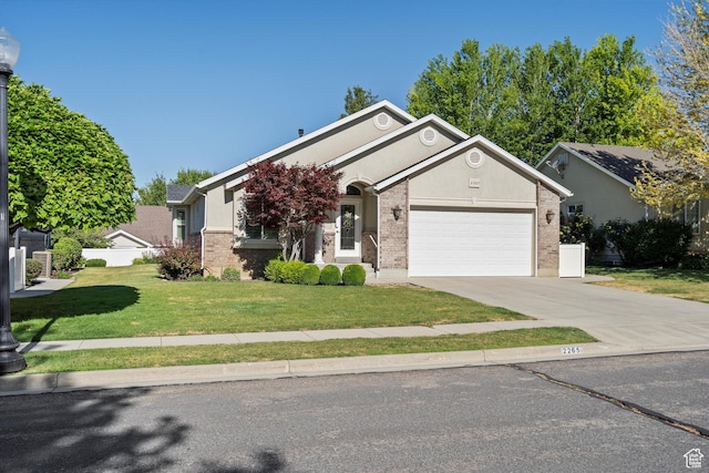 2265 N 515 E, North Ogden, UT 84414 - single story home featuring driveway, a garage, and brick siding