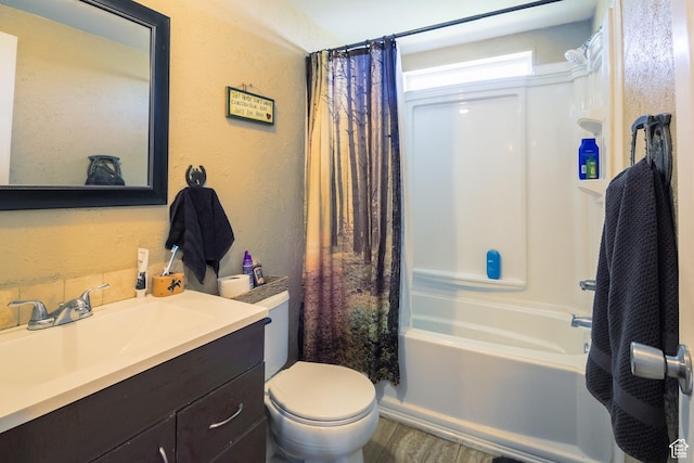 3165 E 5300 S, Vernal, UT 84078 - full bath featuring vanity, shower / bath combo with shower curtain, a textured wall, and wood finished floors