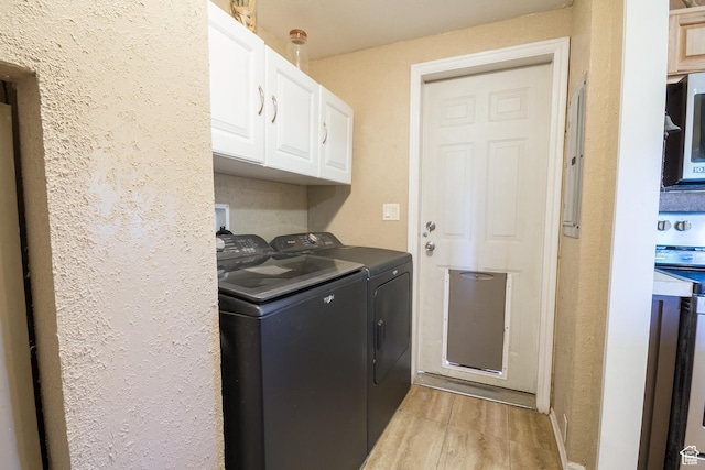 3165 E 5300 S, Vernal, UT 84078 - washroom featuring cabinet space, washer and dryer, light wood-style floors, and a textured wall