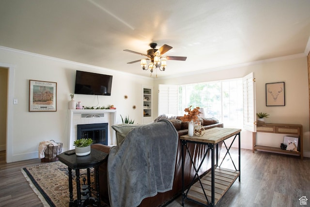129 N 100 E, Ephraim, UT 84627 - living area with ornamental molding, a glass covered fireplace, a ceiling fan, and wood finished floors