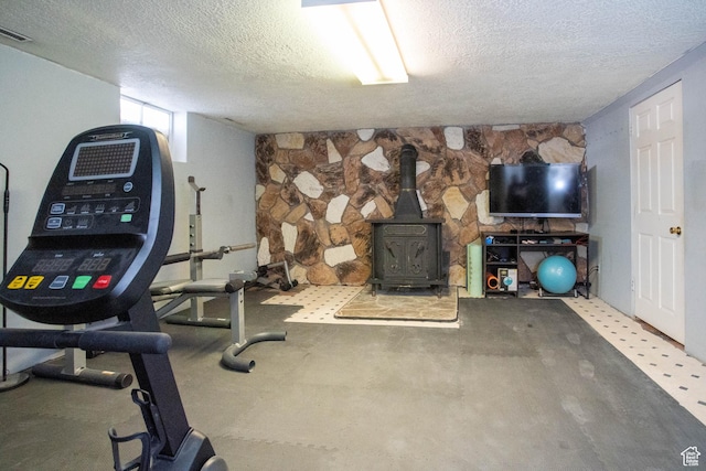 129 N 100 E, Ephraim, UT 84627 - exercise area featuring a textured ceiling and a wood stove