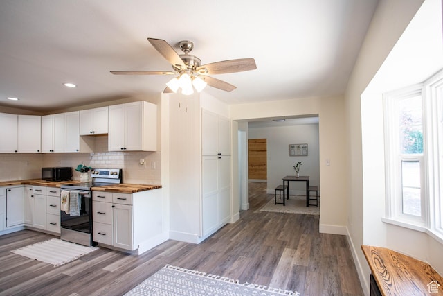 129 N 100 E, Ephraim, UT 84627 - kitchen with electric stove, butcher block counters, plenty of natural light, white cabinetry, and recessed lighting