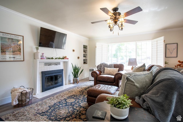 129 N 100 E, Ephraim, UT 84627 - living area featuring crown molding, ceiling fan, a fireplace, and wood finished floors