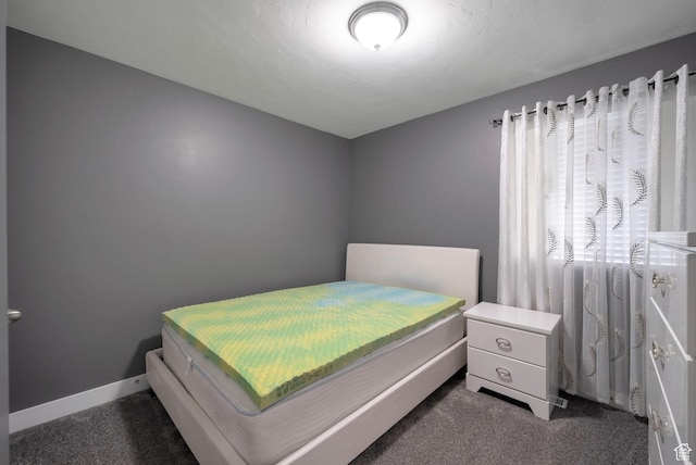 5198 W Courtly Ln, Herriman, UT 84096 - bedroom with dark colored carpet and baseboards