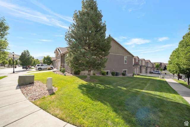5198 W Courtly Ln, Herriman, UT 84096 - view of side of home with a residential view and a lawn