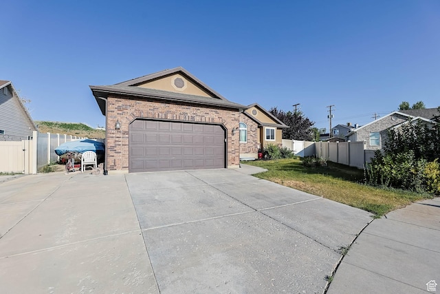 6228 S Waller Ln, West Jordan, UT 84081 - ranch-style house featuring concrete driveway, a garage, and brick siding