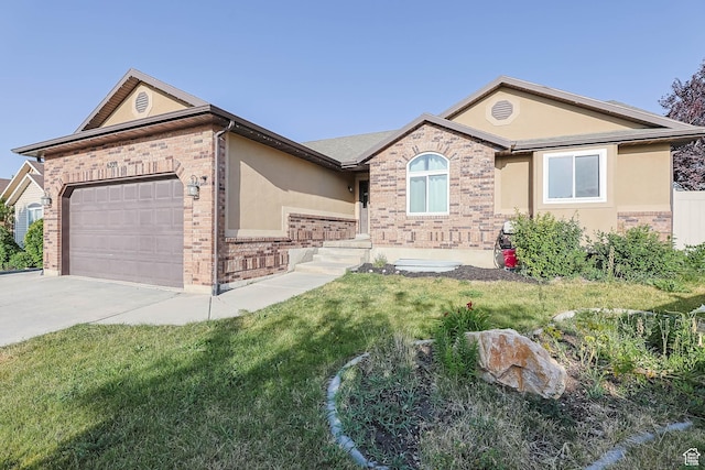 6228 S Waller Ln, West Jordan, UT 84081 - ranch-style house with a garage, stucco siding, brick siding, and concrete driveway