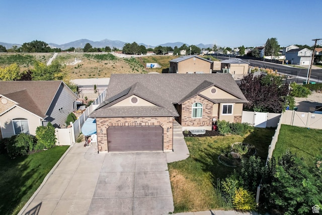 6228 S Waller Ln, West Jordan, UT 84081 - single story home with a gate, brick siding, concrete driveway, and a garage
