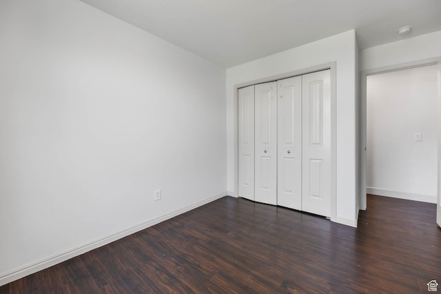 6228 S Waller Ln, West Jordan, UT 84081 - unfurnished bedroom featuring dark wood-style flooring and a closet